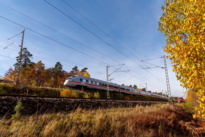 German high speed intercity train traveling on a sunny autumn day