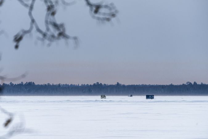 Ice fishing Houses on cold day on Lake Winnibigoshish in Itasca County, Minnesota