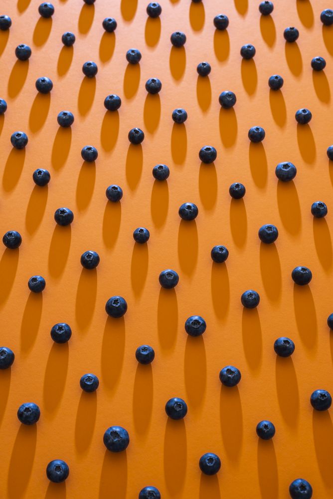 Blueberries aligned in a pattern