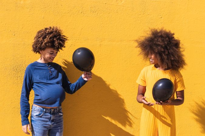 Black kids having fun with balloons