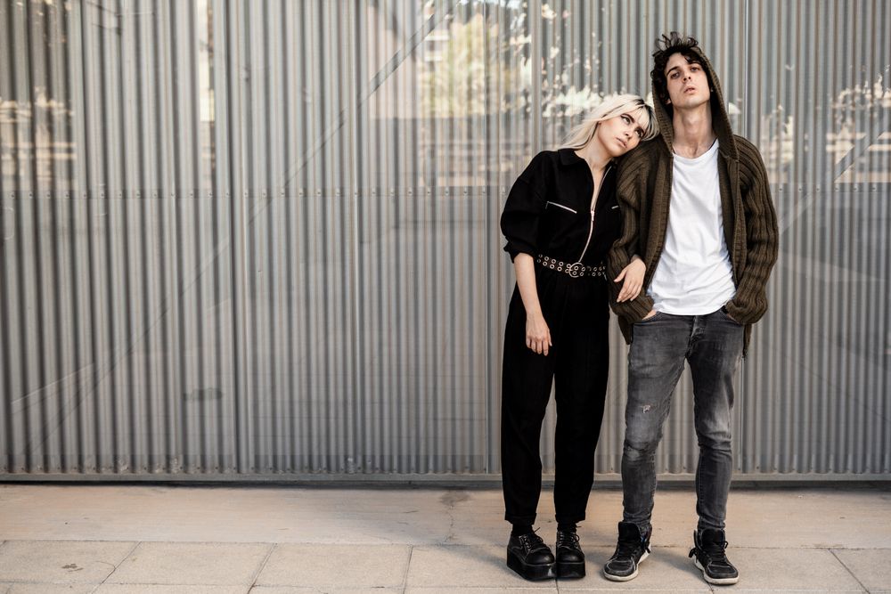 Couple near stripped modern building