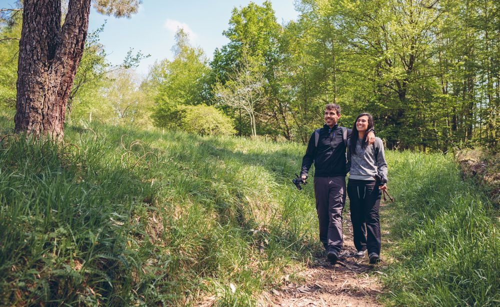 Hikers walking embraced