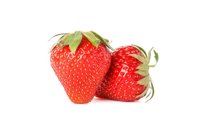 Strawberries isolated on light background. Summer sweet fruits and berries