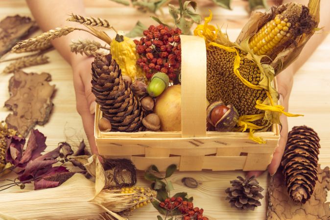 Basket with fall ingredients held in womans hands