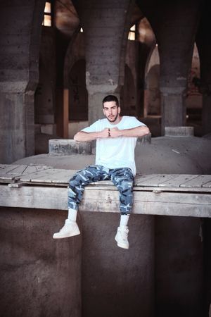 Serious man in desolated cathedral