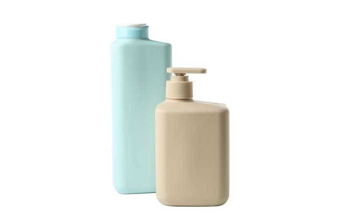 Blank bathroom bottles isolated on light background. Bathroom accessories