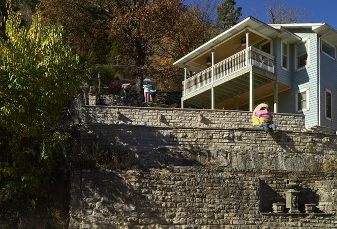 The nursery rhyme character Humpty Dumpty sits on a wall in Eureka Springs, AR