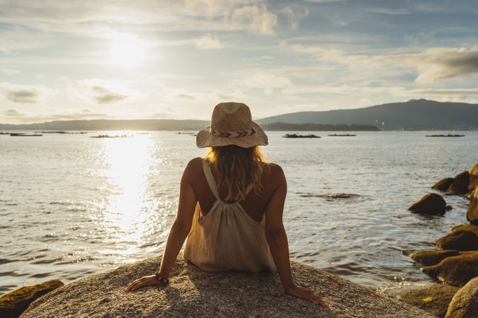 Blond woman resting at seaside