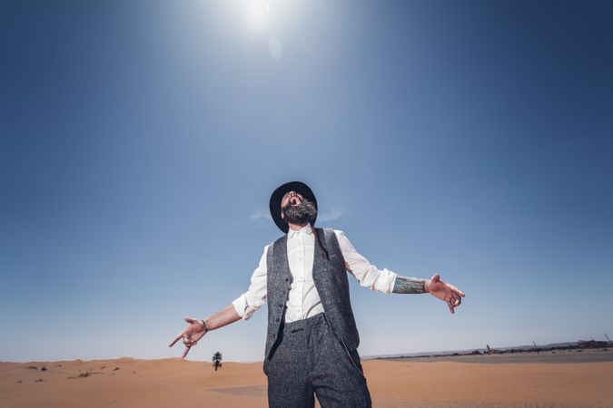Bearded cowboy in desert