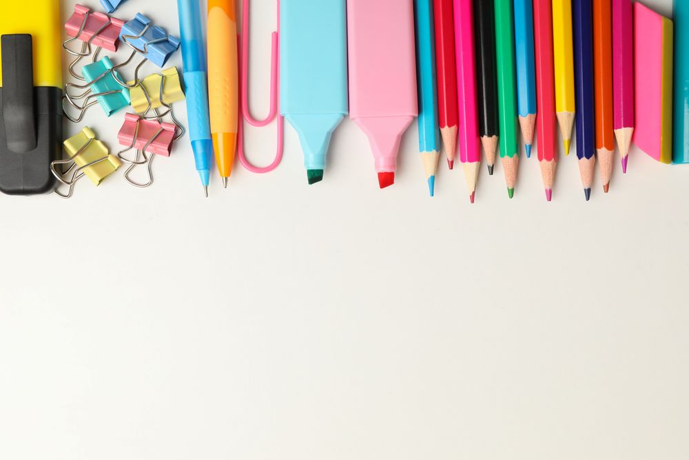 Frame of school supplies on blank background, space for text