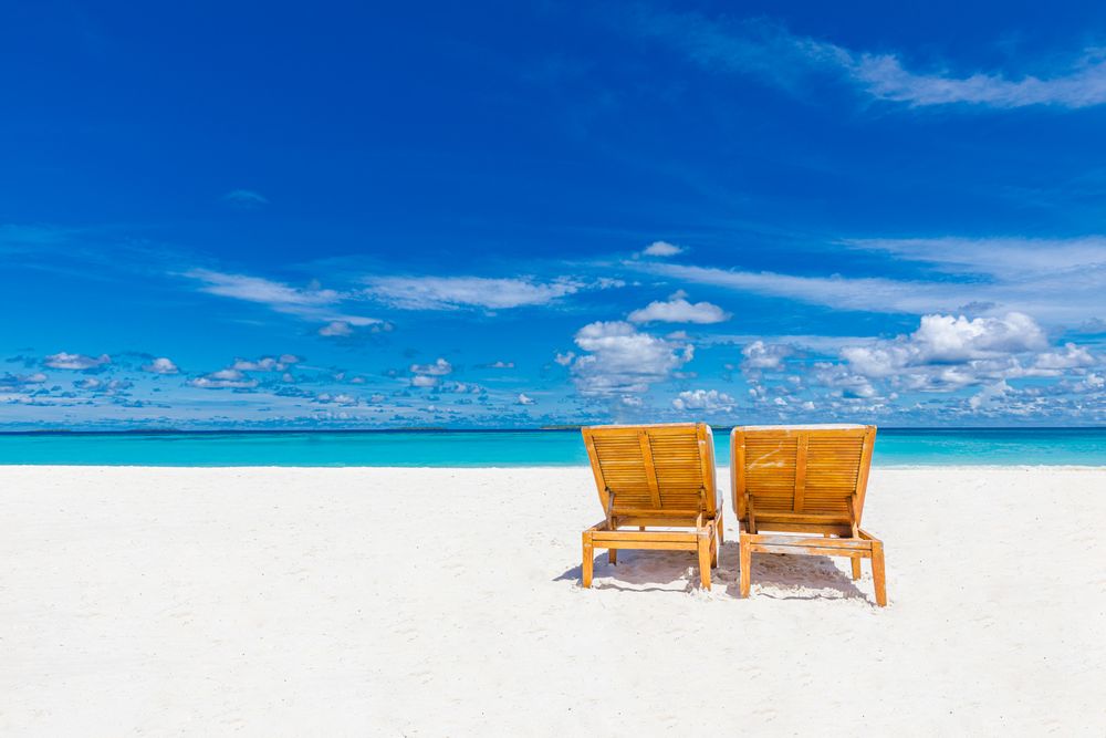 Blue sky over a tropical beach with fine sand