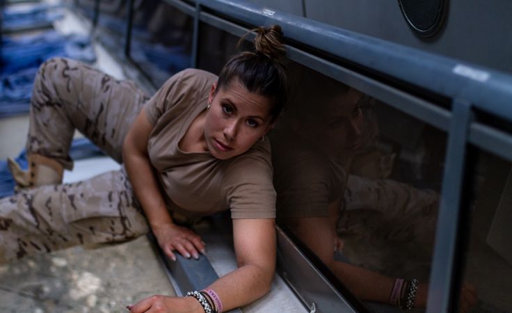 Military woman inside modern vehicle