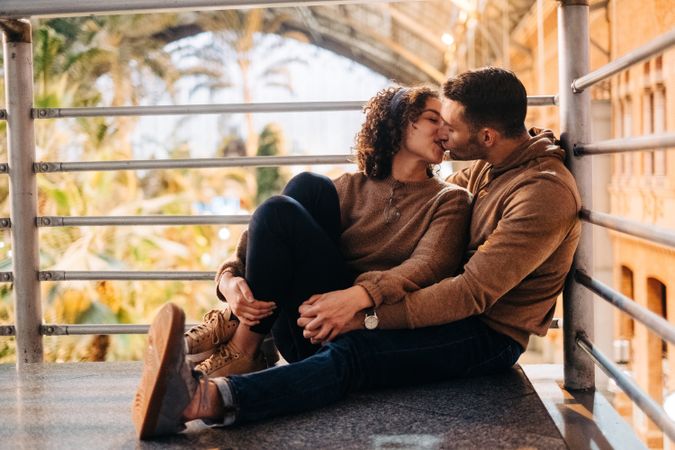 Happy couple hugging in pavilion