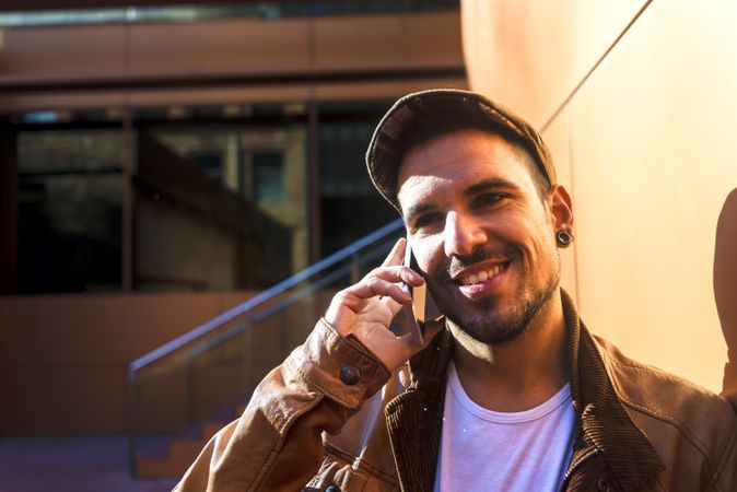 Man using mobile phone in modern building