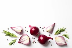 Flat lay composition with red onion and spices on neutral background