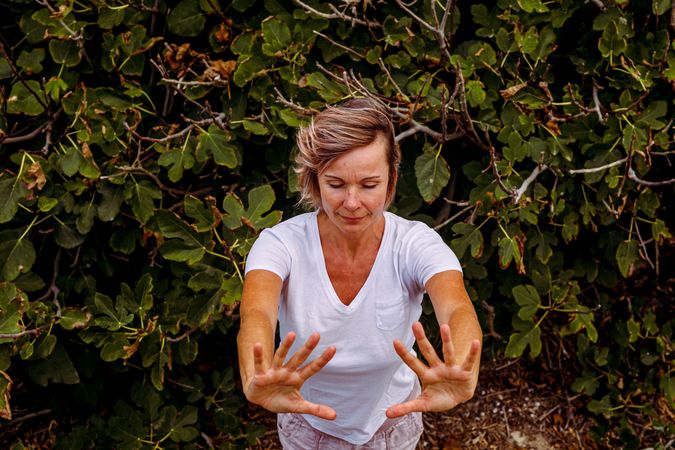 Adult woman practicing martial arts in nature