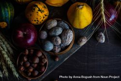 Top view of autumnal foods, nuts, squash and apples on wooden table 43G6P4