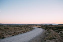 Sunset over bend in the road, landscape