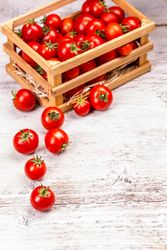Cherry tomatoes in wooden box