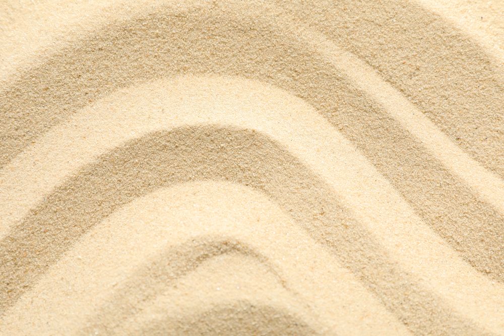 Seamless sand on a whole background, space for text and closeup. Summer vacation backdrop