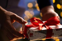 Man Holding Christmas Gift Box