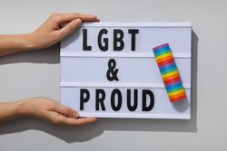 LGBT parade concept, inscription on board.