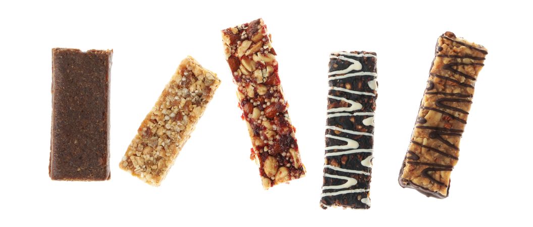 Tasty granola bars isolated on blank background