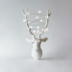 Christmas reindeer head with antlers with christmas lights