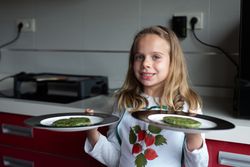 Smiling girl with vegan cutlets