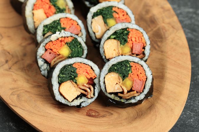 Korean Roll Rice Kimbap with Carrot, Spinach, Eggs, Beef Luncheon, and Danmuji