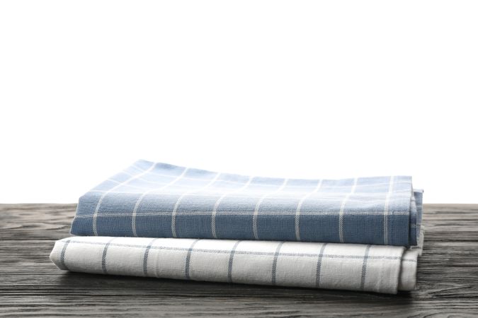 Fabric napkins on table against plain background, space for text