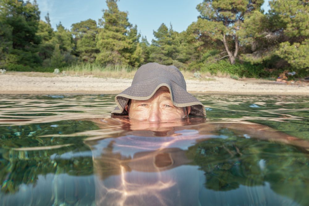 Man swimming under water in sea
