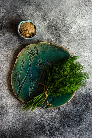 Blue plate with fresh dill