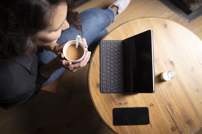 Young female using digital tablet in cafe