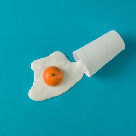 Orange and yogurt in fried egg shape