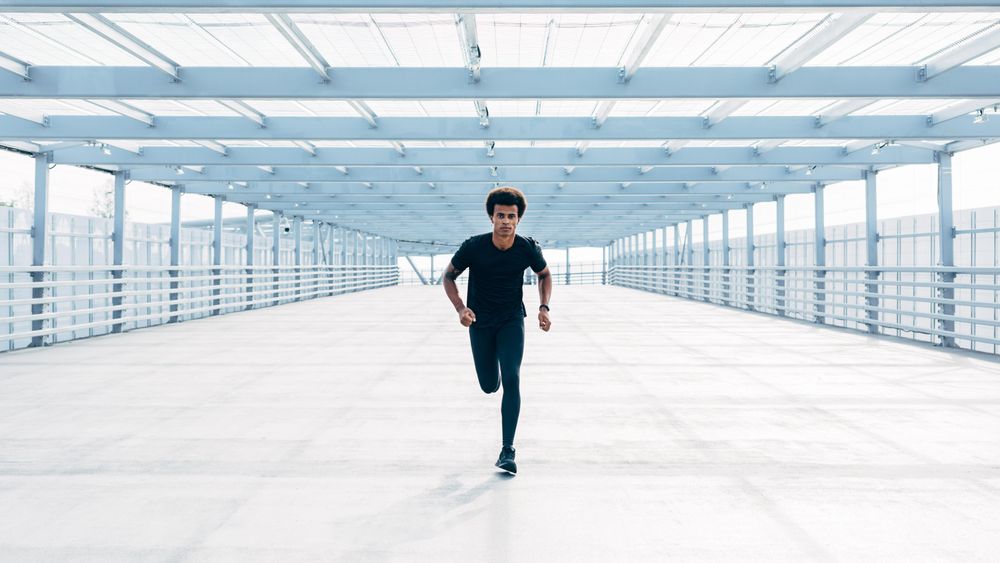 Man working out on bridge in city