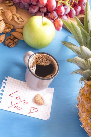 Love you note near coffee and fruits