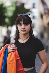 LGBT woman on city street