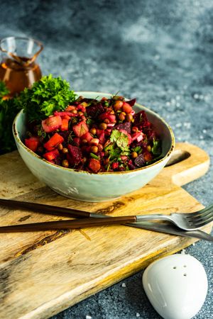Healthy beetroot salad on grey counter with copy space
