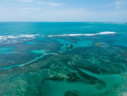 Sailboats atop the reefs of Porto de Galinhas