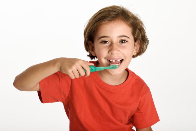 Child brushing her teeth