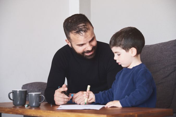 Father and son drawing together