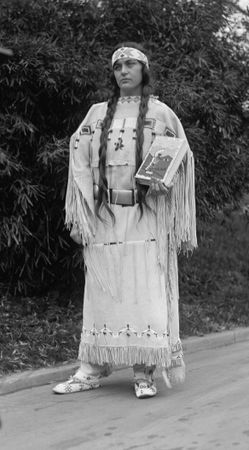 Ruth Muskrat Bronson, a Cherokee, holds a copy of The Red Man in the United States