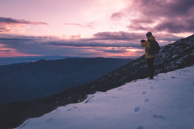 Anonymous tourist on snowy mountain
