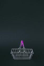 Shopping basket on dark background