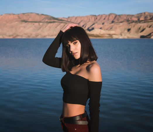 Sensual female standing near water