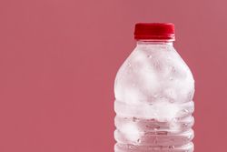 Bottle of water with ice cubes