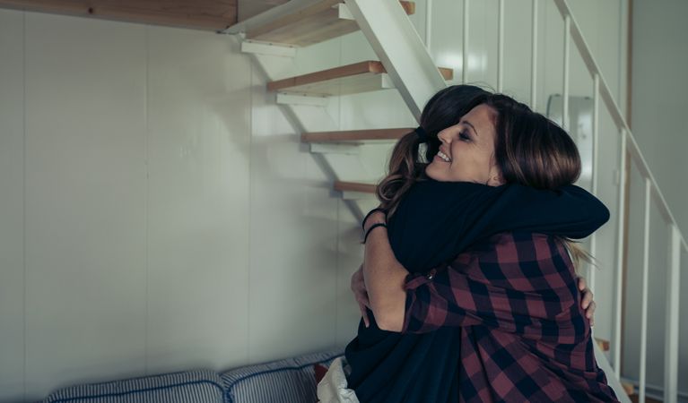 Happy woman hugging her friend