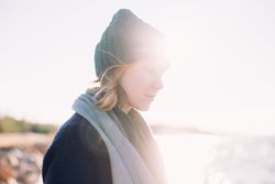 Woman on overcast day by the coast