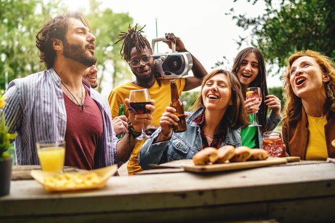 A diverse group of friends having a great time at an outdoor bar